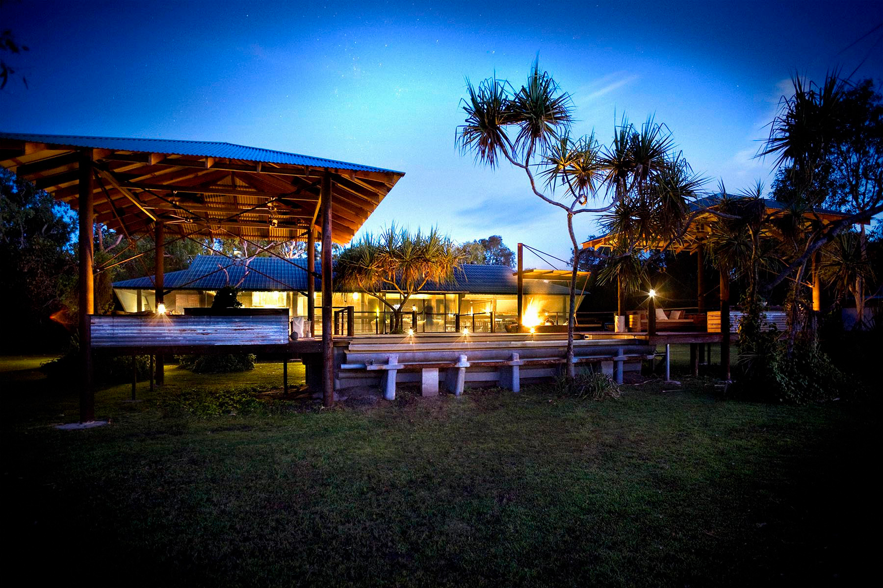Safari-Top-End_Bamurru-pool-and-dining-area-at-night